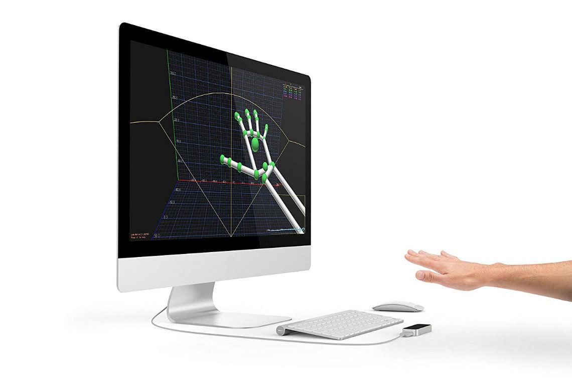 computer with a hand tracking sensor and hand