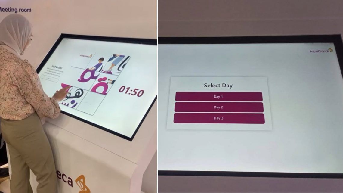 woman playing a touchscreen game